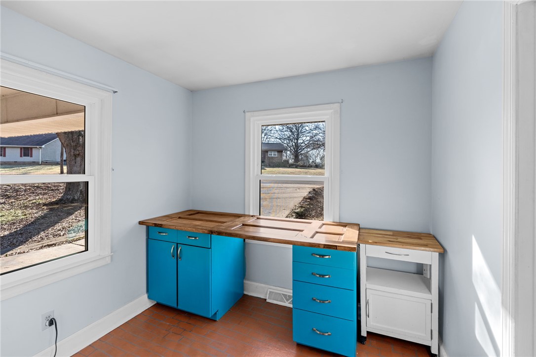 420 Brock Street Central, SC 29630 - Photo 13 of 45 This versatile room offers a functional workspace and ample natural light for various uses.