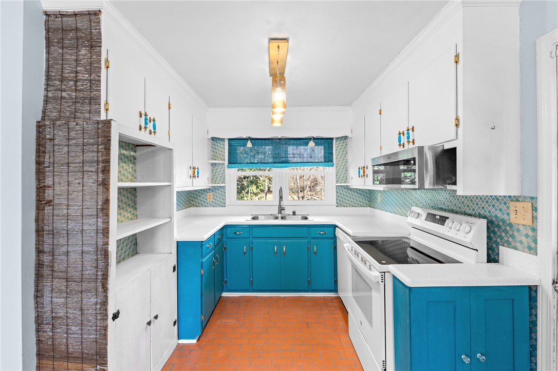 420 Brock Street Central, SC 29630 - Photo 14 of 45 This bright kitchen features ample counter space and vibrant cabinetry, perfect for any culinary enthusiast.