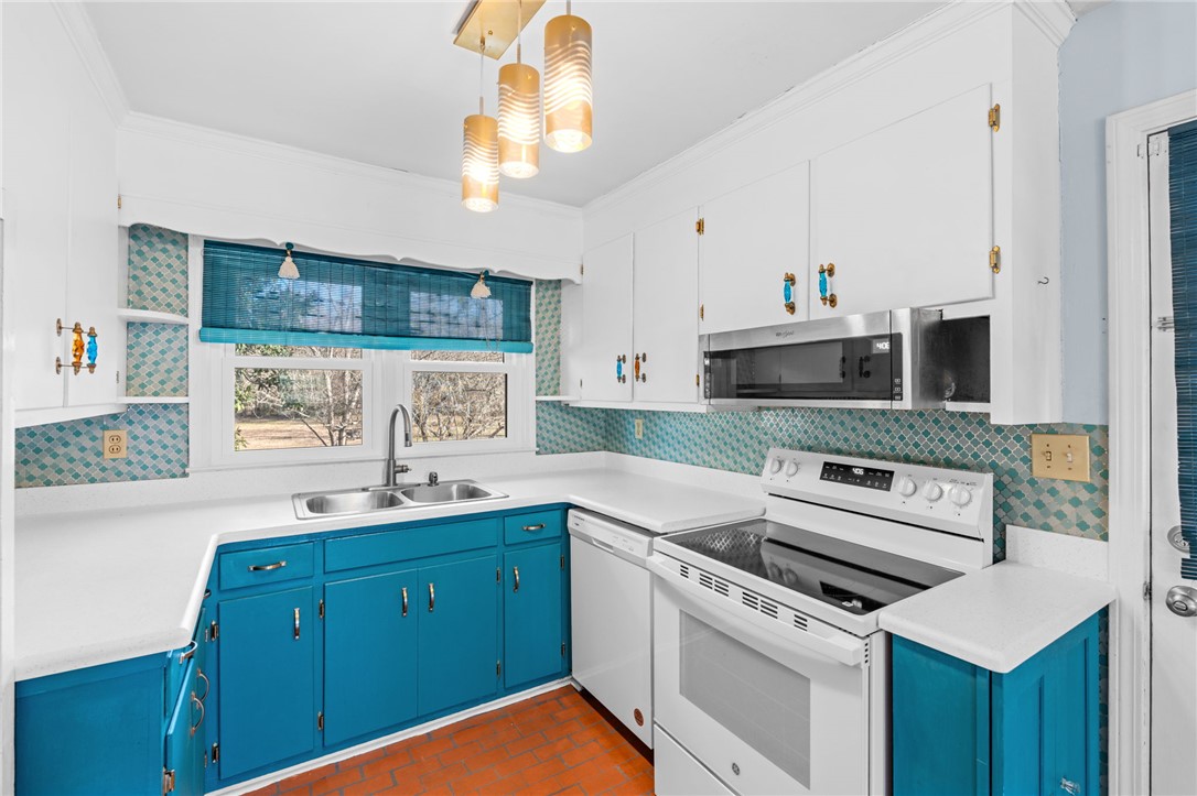 420 Brock Street Central, SC 29630 - Photo 15 of 45 This bright kitchen features bold cabinetry and essential appliances.