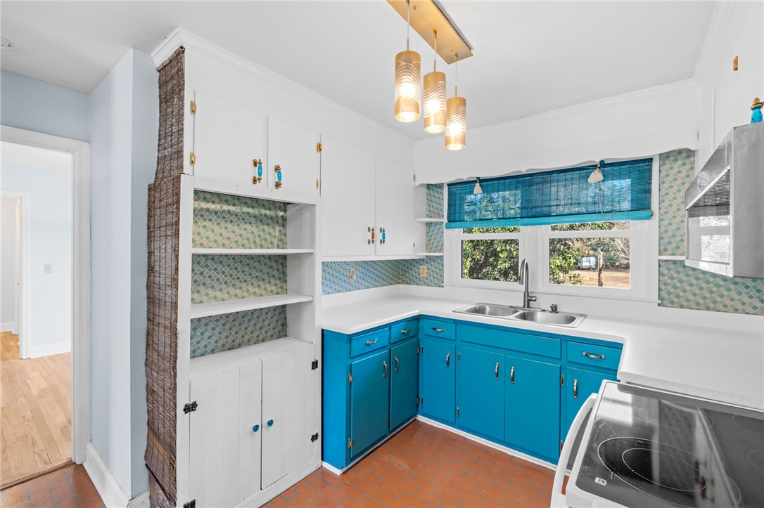420 Brock Street Central, SC 29630 - Photo 16 of 45 This charming kitchen features vibrant cabinetry and ample natural light, perfect for culinary endeavors.