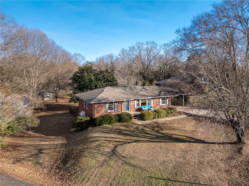 420 Brock Street Central, SC 29630 - Photo 2 of 45 This classic brick residence offers comfort and natural beauty, surrounded by mature trees.