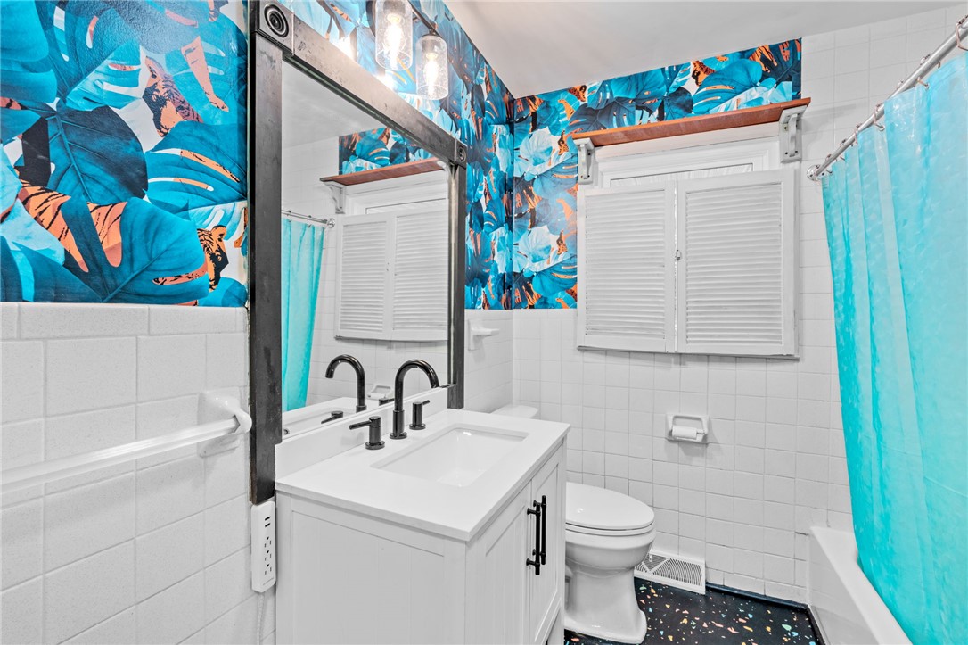 420 Brock Street Central, SC 29630 - Photo 21 of 45 This bathroom features a contemporary vanity and bold wallpaper.