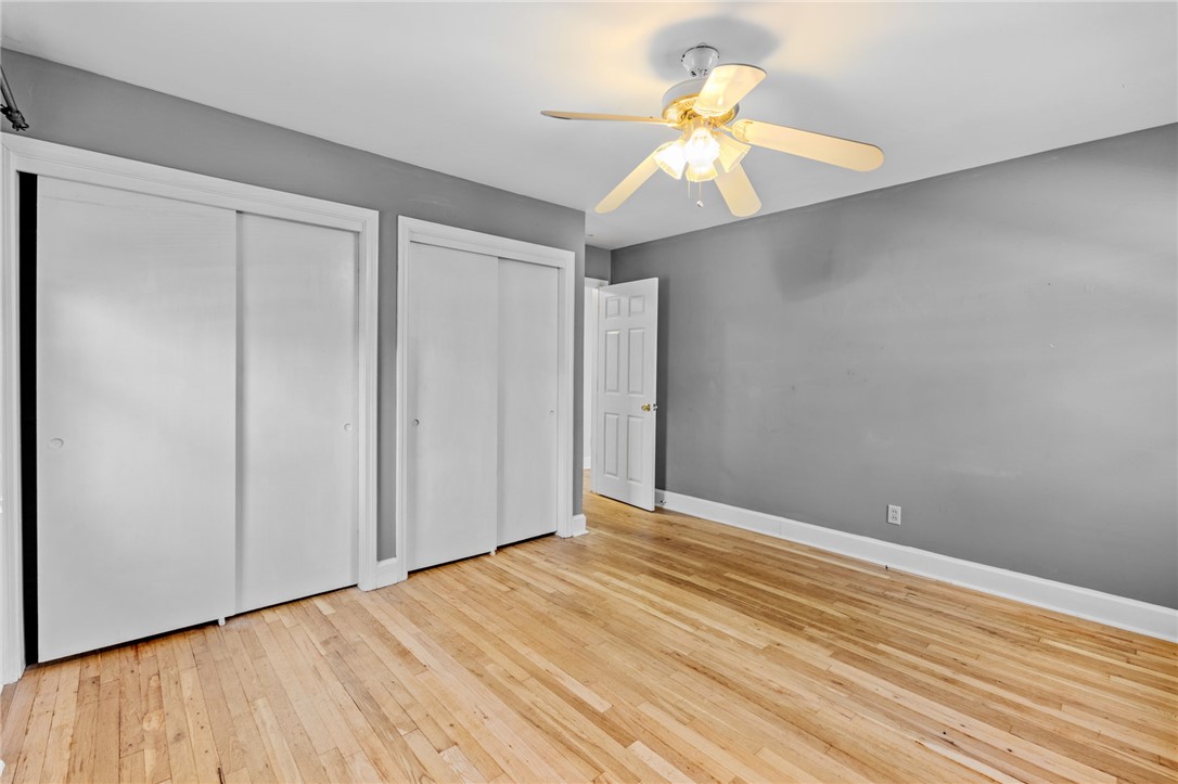 420 Brock Street Central, SC 29630 - Photo 23 of 45 This inviting bedroom features rich hardwood flooring and a ceiling fan, offering both style and comfort.