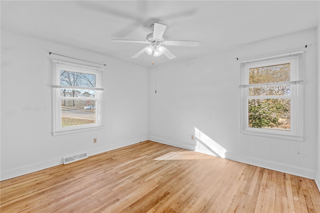420 Brock Street Central, SC 29630 - Photo 24 of 45 This airy bedroom offers beautiful hardwood floors and abundant natural light.