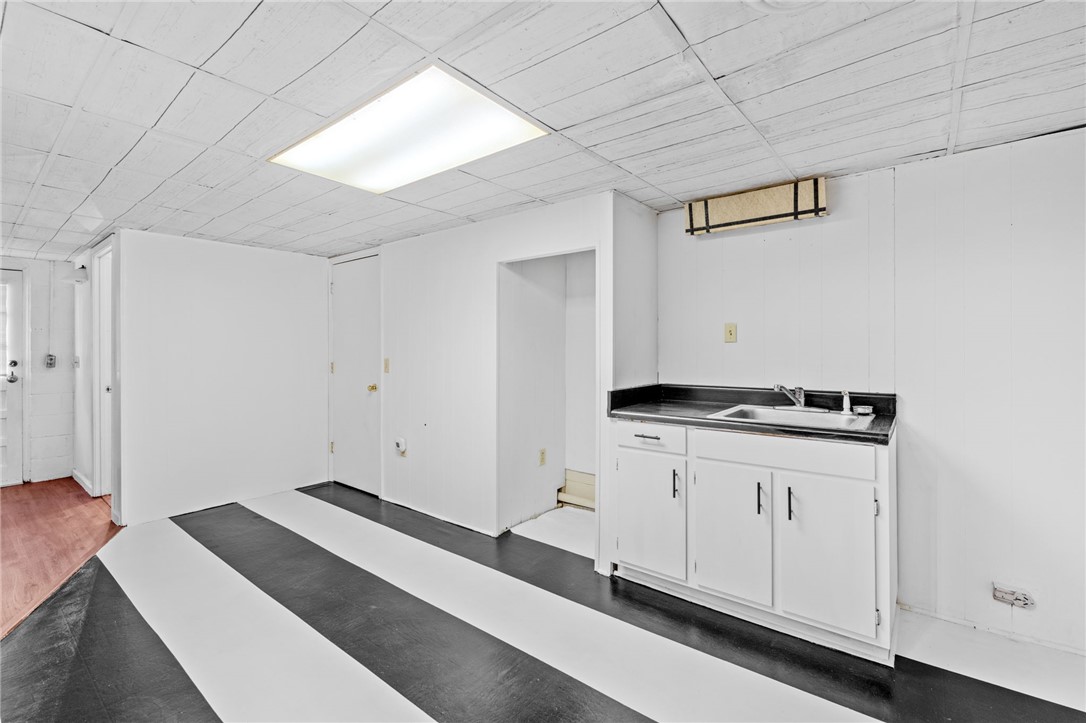 420 Brock Street Central, SC 29630 - Photo 27 of 45 This versatile space offers ample potential, featuring a practical sink and durable flooring.