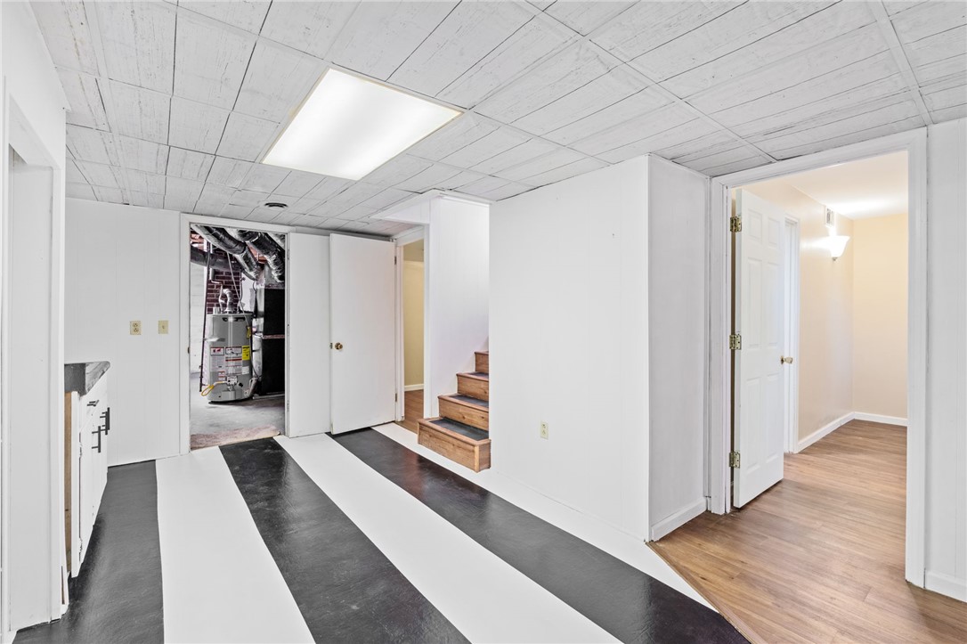 420 Brock Street Central, SC 29630 - Photo 29 of 45 Functional basement space with a unique striped floor and accessible stairs.