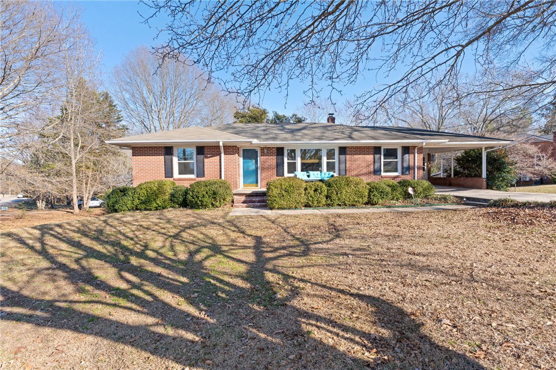 420 Brock Street Central, SC 29630 - Photo 3 of 45 This classic brick residence features a welcoming entrance and mature landscaping.