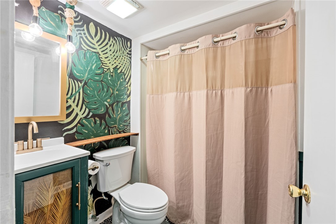 420 Brock Street Central, SC 29630 - Photo 31 of 45 This vibrant bathroom offers a fresh aesthetic, combining practicality with playful design elements.