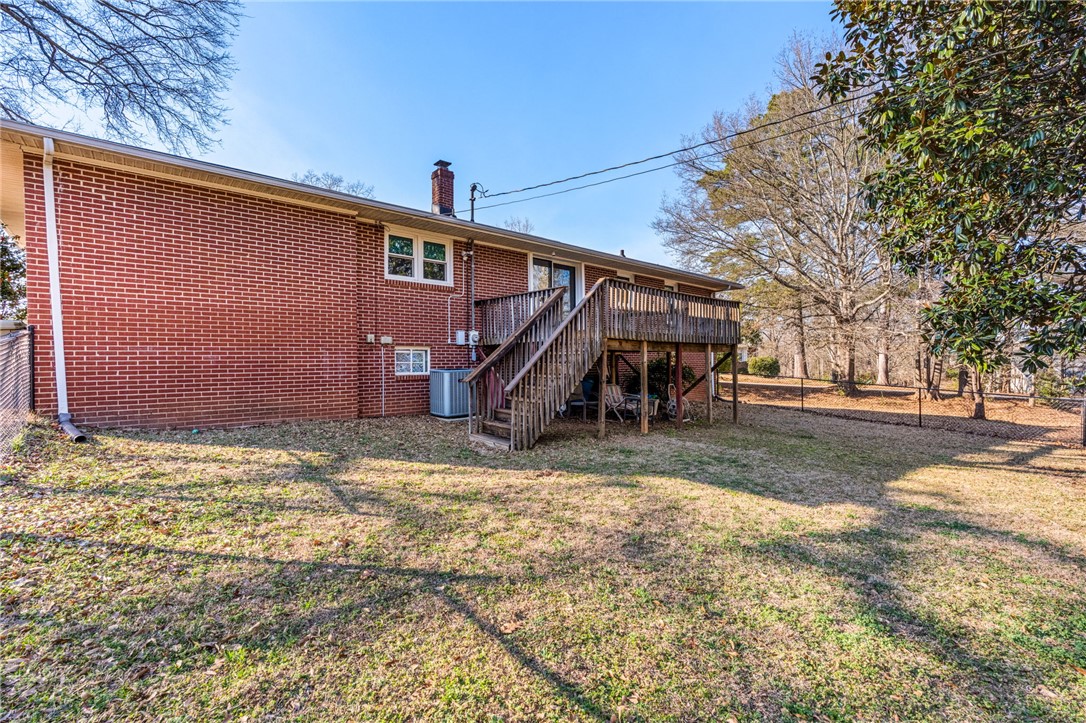 420 Brock Street Central, SC 29630 - Photo 38 of 45 This residence features a brick exterior and a spacious outdoor deck, perfect for relaxation.