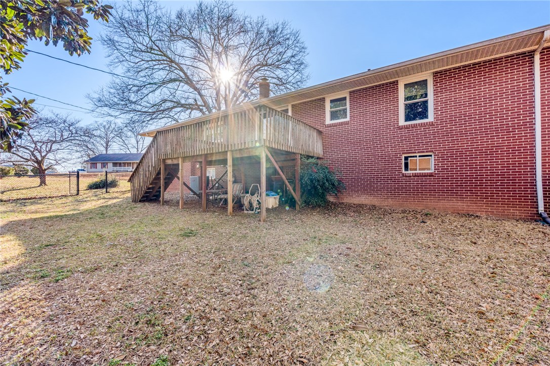 420 Brock Street Central, SC 29630 - Photo 40 of 45 This outdoor space features a raised wooden deck with stairs to a spacious yard.