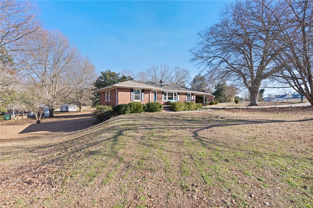 420 Brock Street Central, SC 29630 - Photo 42 of 45 This classic brick residence features a welcoming front porch and ample yard space.