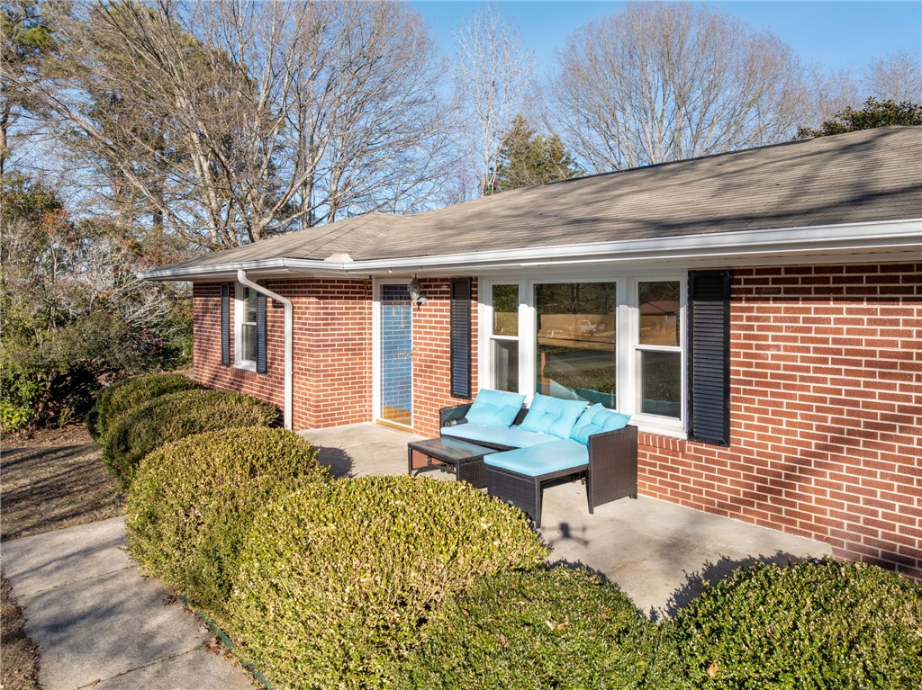 420 Brock Street Central, SC 29630 - Photo 5 of 45 This charming brick residence features a welcoming patio, perfect for outdoor relaxation.