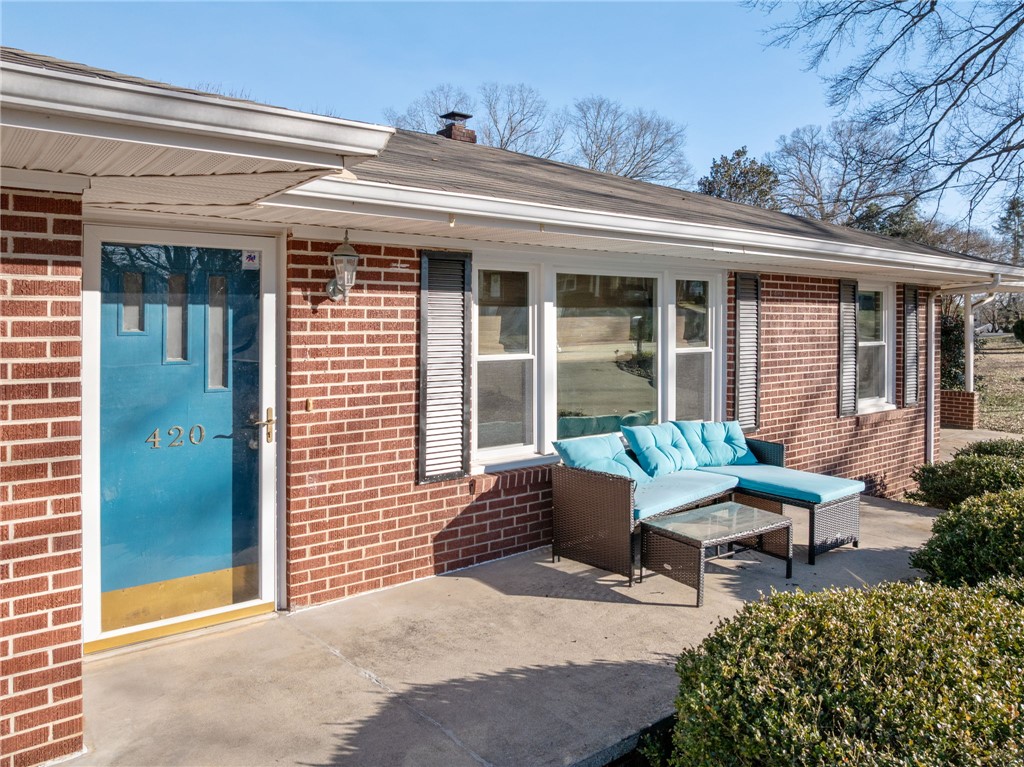 420 Brock Street Central, SC 29630 - Photo 6 of 45 This charming home features a classic brick exterior and an inviting front porch.