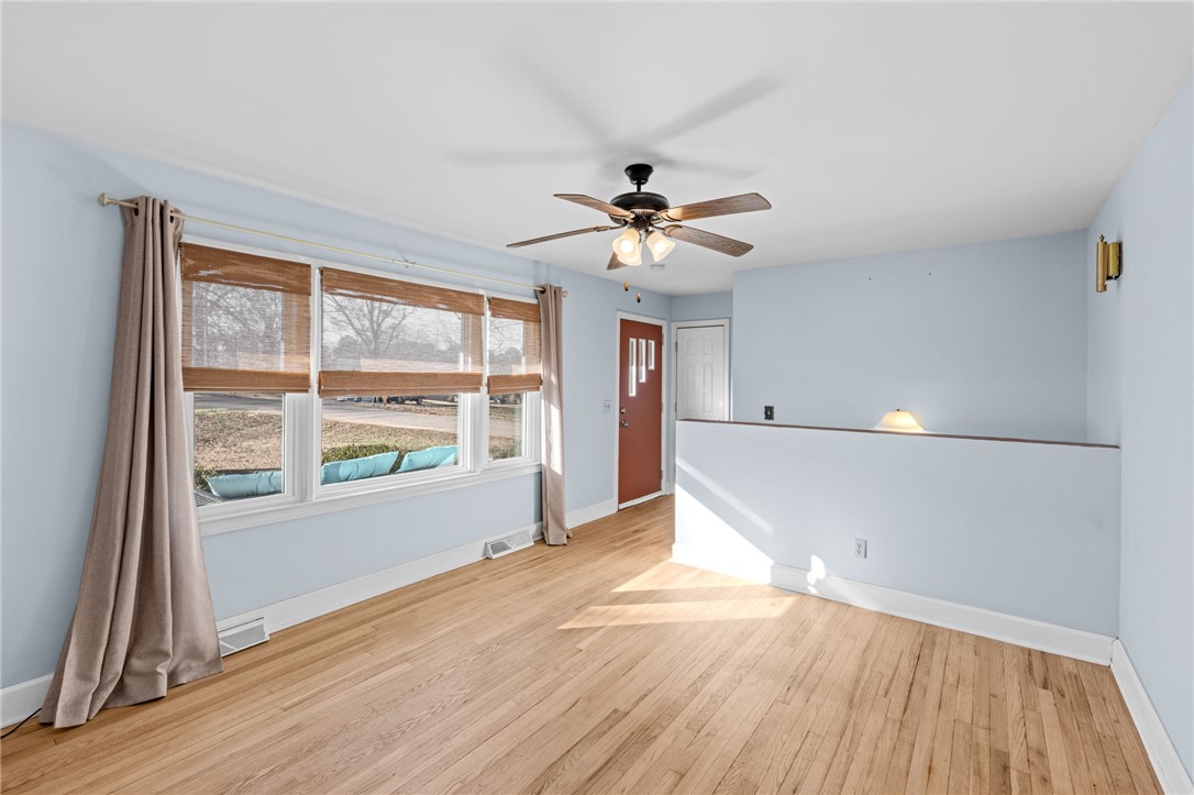 420 Brock Street Central, SC 29630 - Photo 9 of 45 Bright and airy living room featuring hardwood flooring and a stylish ceiling fan.