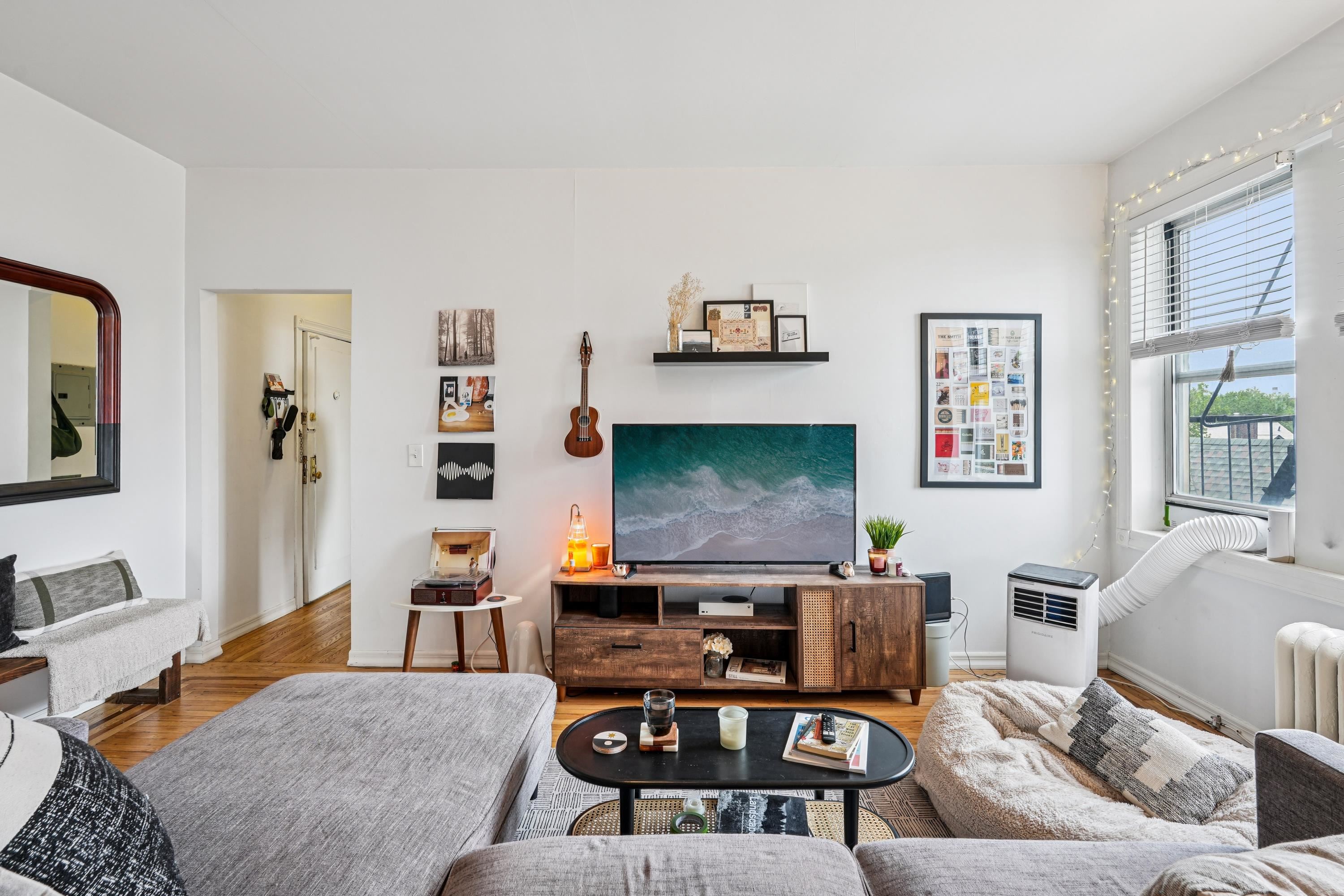 851 Boulevard East, Unit D2 Weehawken, NJ 07086 - Photo 22 of 42 a living room with furniture and a flat screen tv
