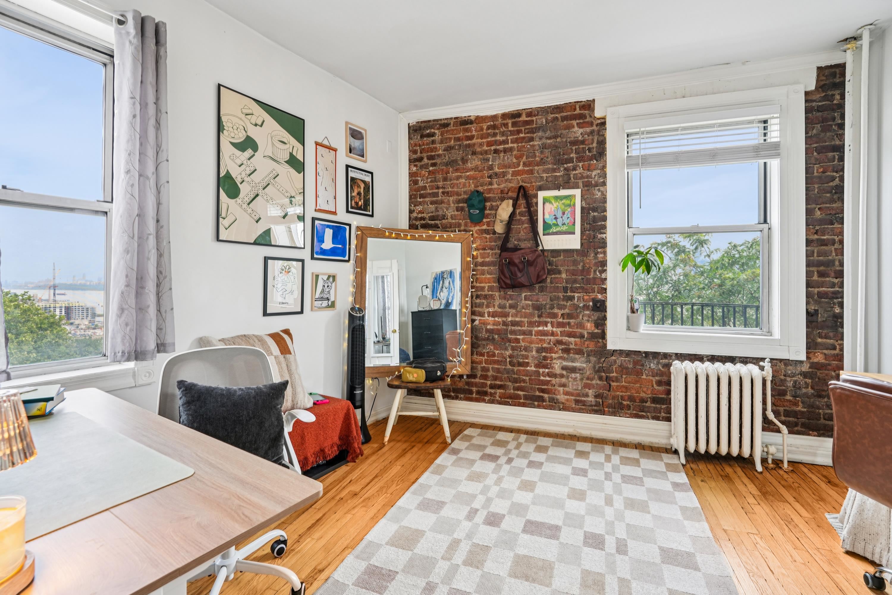 851 Boulevard East, Unit D2 Weehawken, NJ 07086 - Photo 23 of 42 a bedroom with furniture and a window