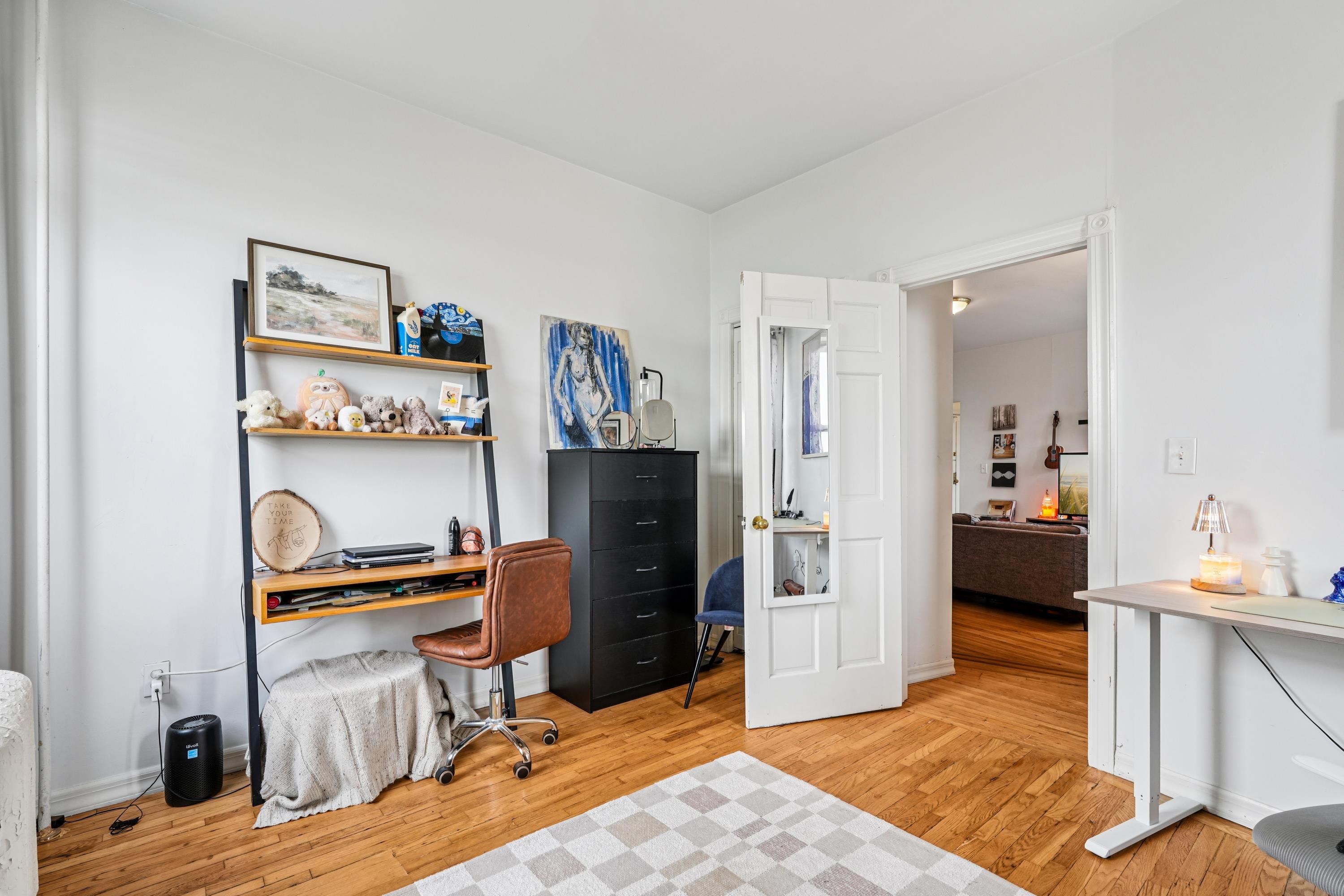 851 Boulevard East, Unit D2 Weehawken, NJ 07086 - Photo 25 of 42 a view of a workspace with furniture and bedroom