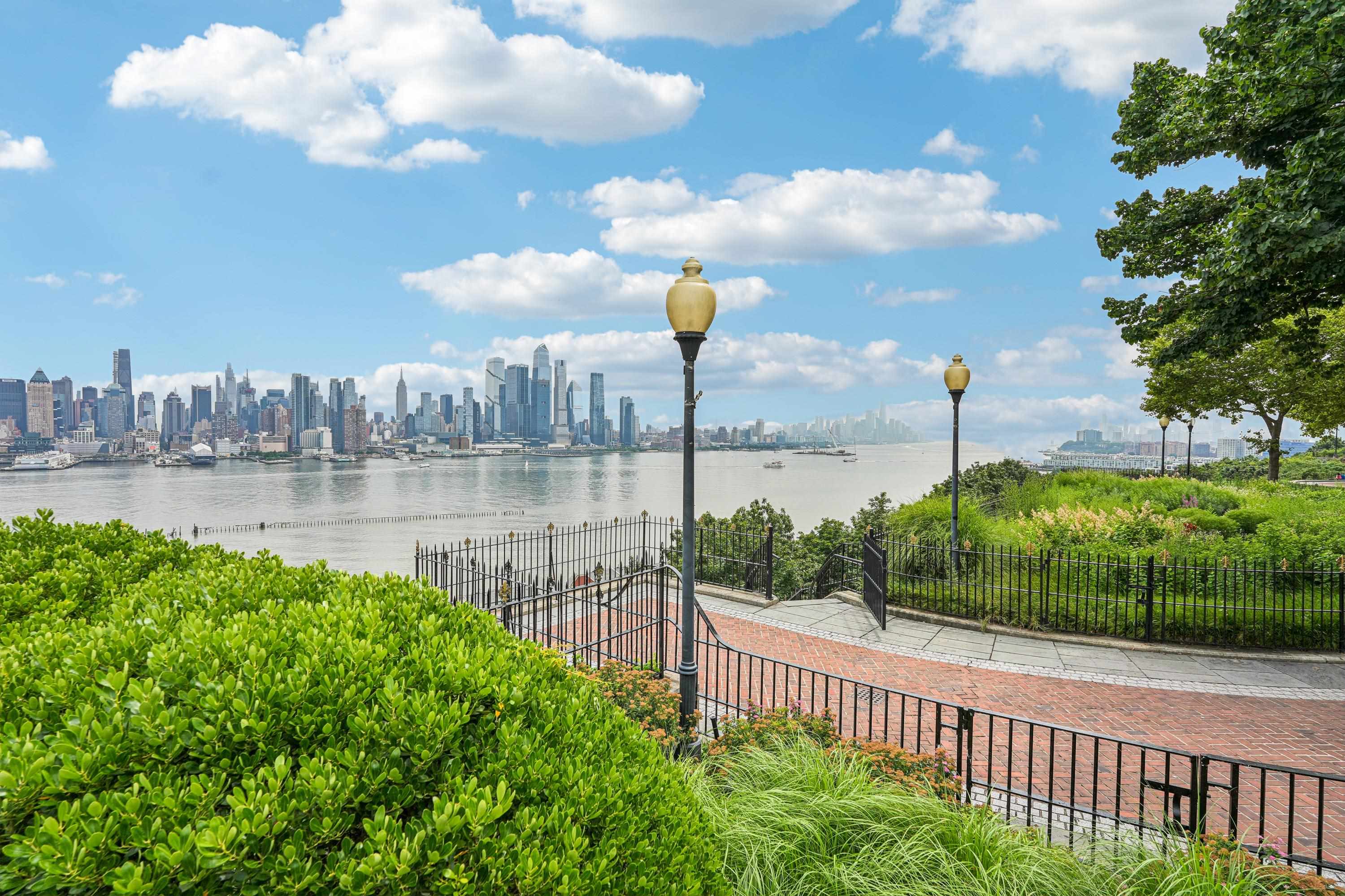 851 Boulevard East, Unit D2 Weehawken, NJ 07086 - Photo 42 of 42 a view of a lake and a yard