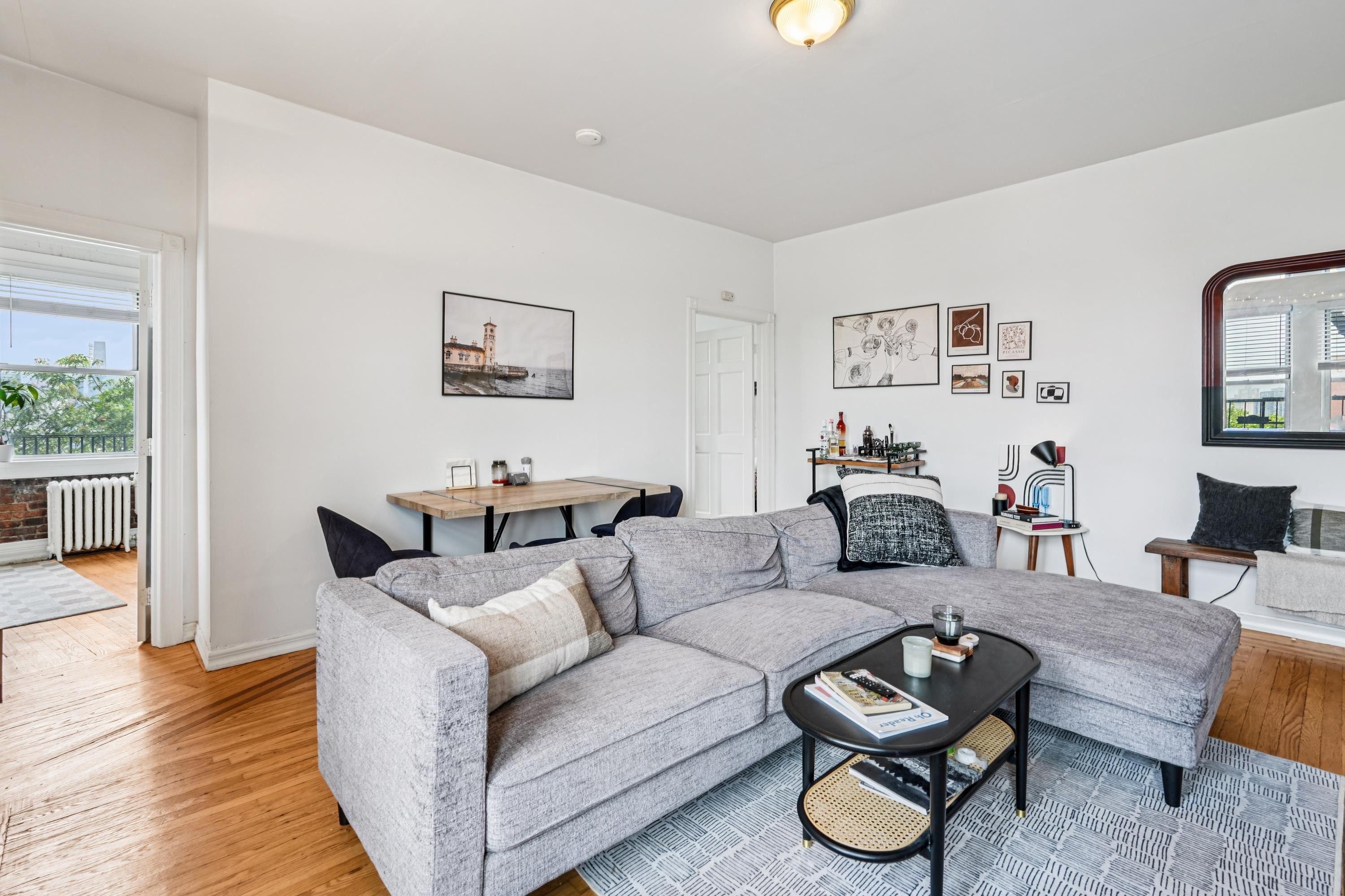 851 Boulevard East, Unit D2 Weehawken, NJ 07086 - Photo 6 of 42 a living room with furniture