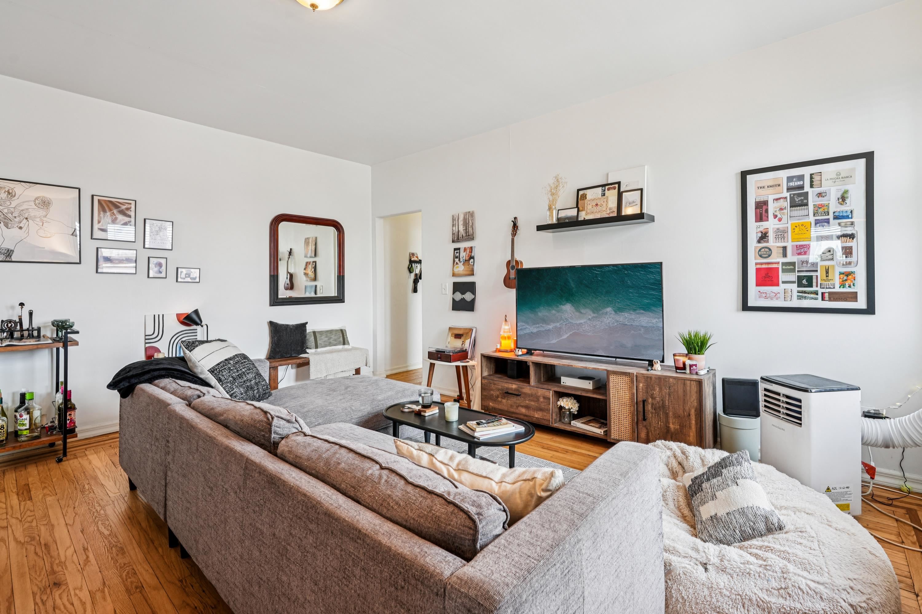851 Boulevard East, Unit D2 Weehawken, NJ 07086 - Photo 8 of 42 a living room with furniture and a flat screen tv
