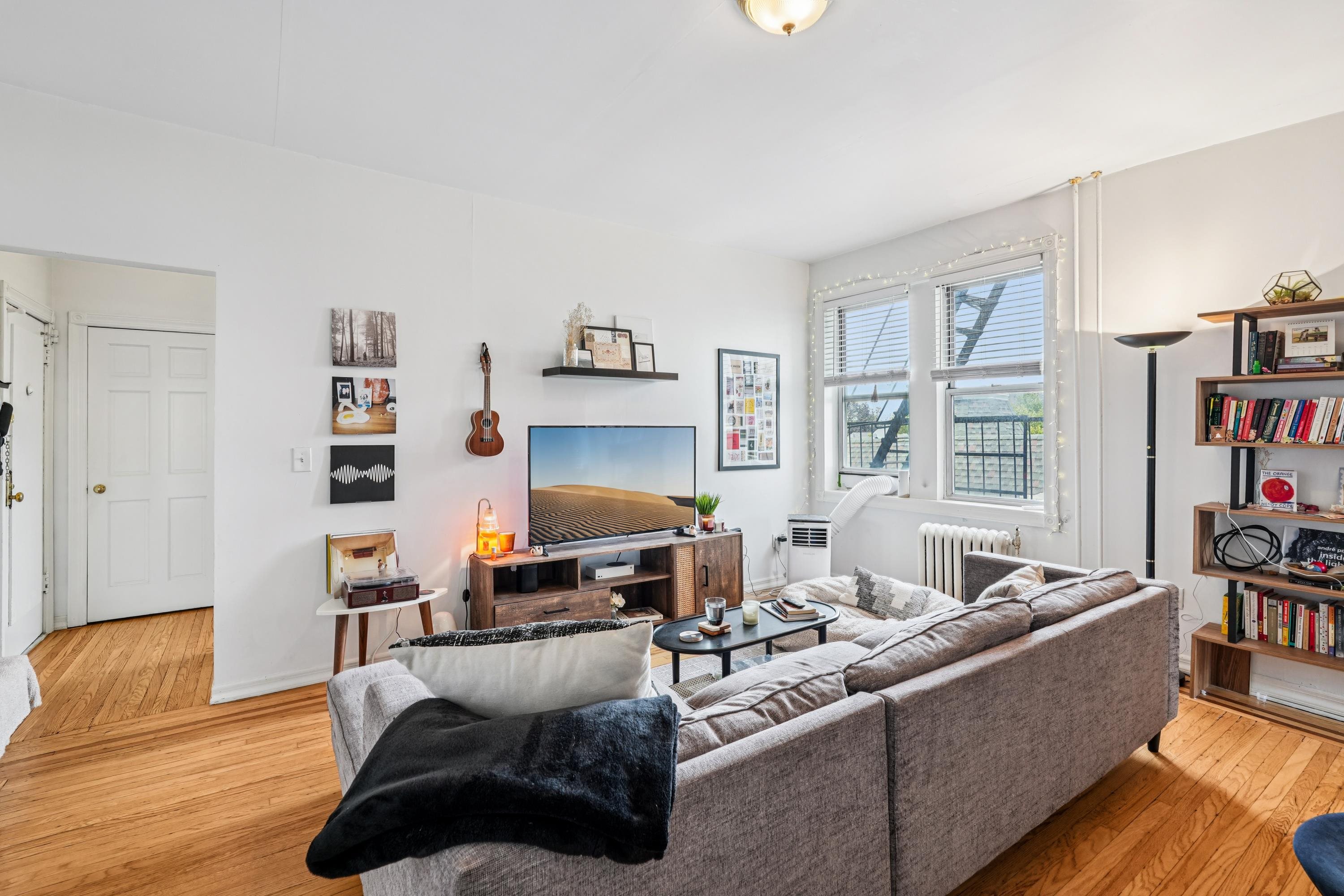 851 Boulevard East, Unit D2 Weehawken, NJ 07086 - Photo 9 of 42 a living room with furniture and a fireplace