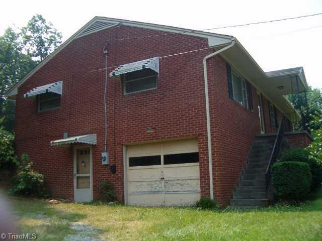 361 Inwood Road Asheboro, NC 27205 - Photo 4 of 9 Exterior Front. left side of home with basemenr/garage