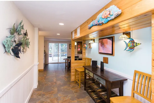 a view of a kitchen with a sink and cabinets