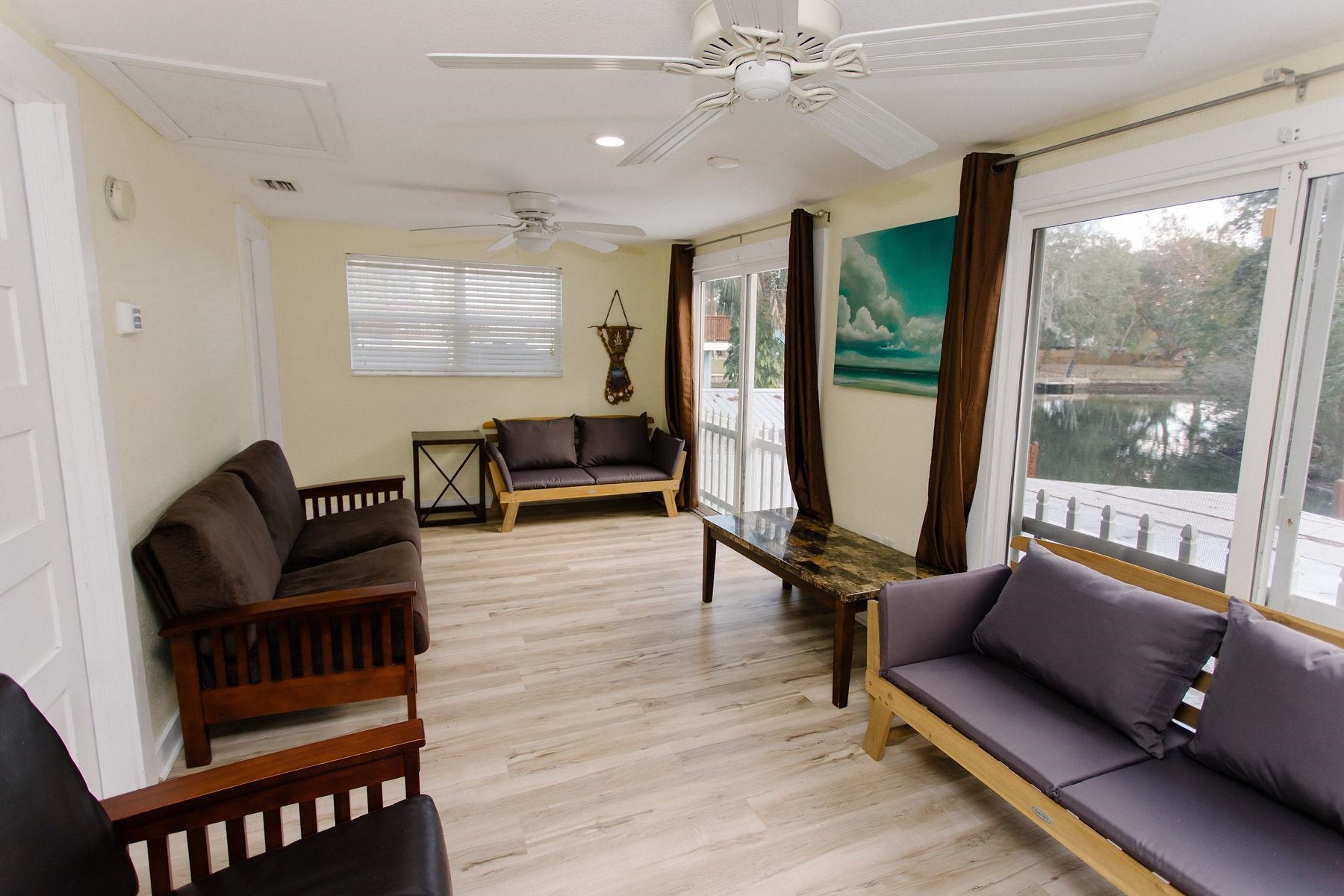 6194 Bear Trail Weeki Wachee, FL 34607 - Photo 31 of 68 a living room with furniture and a large window
