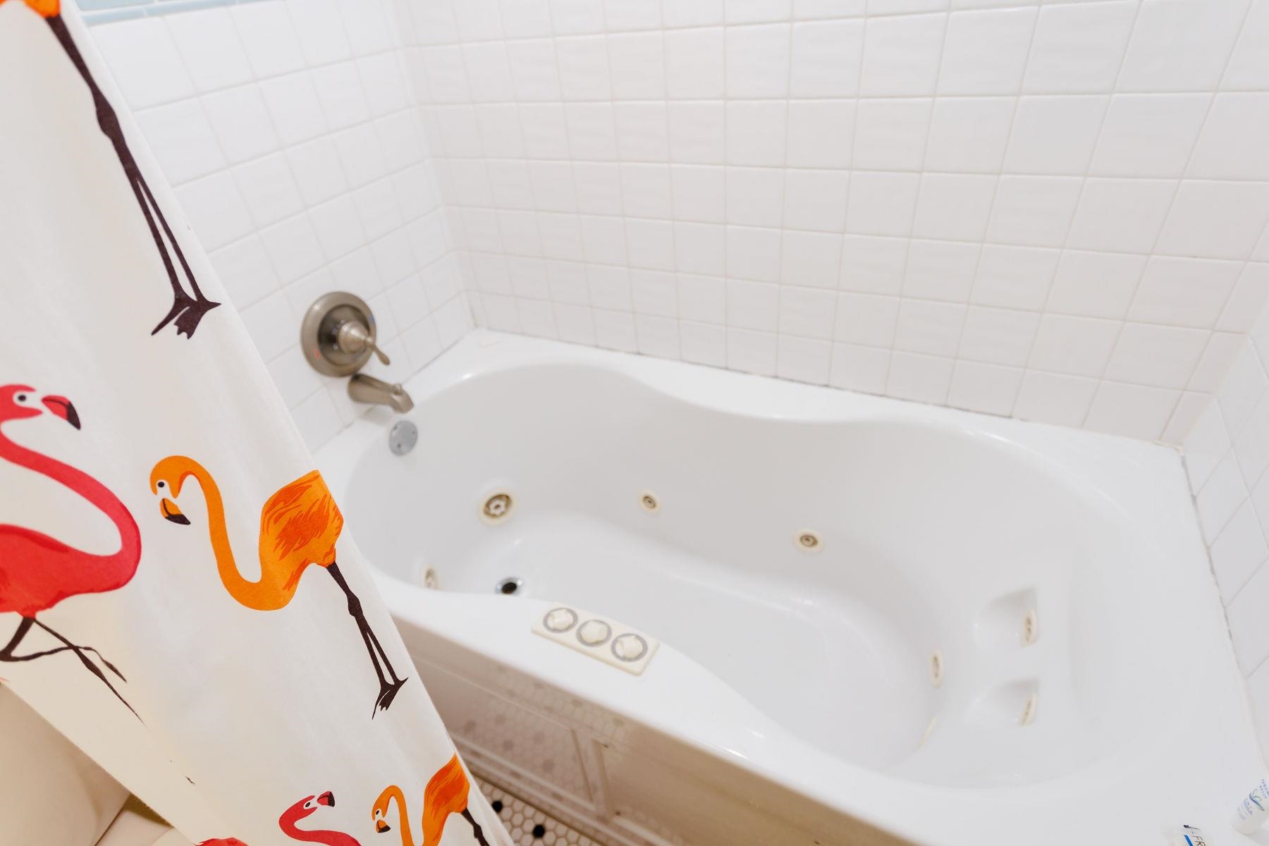 6194 Bear Trail Weeki Wachee, FL 34607 - Photo 35 of 68 a bathroom with a bathtub and a shower