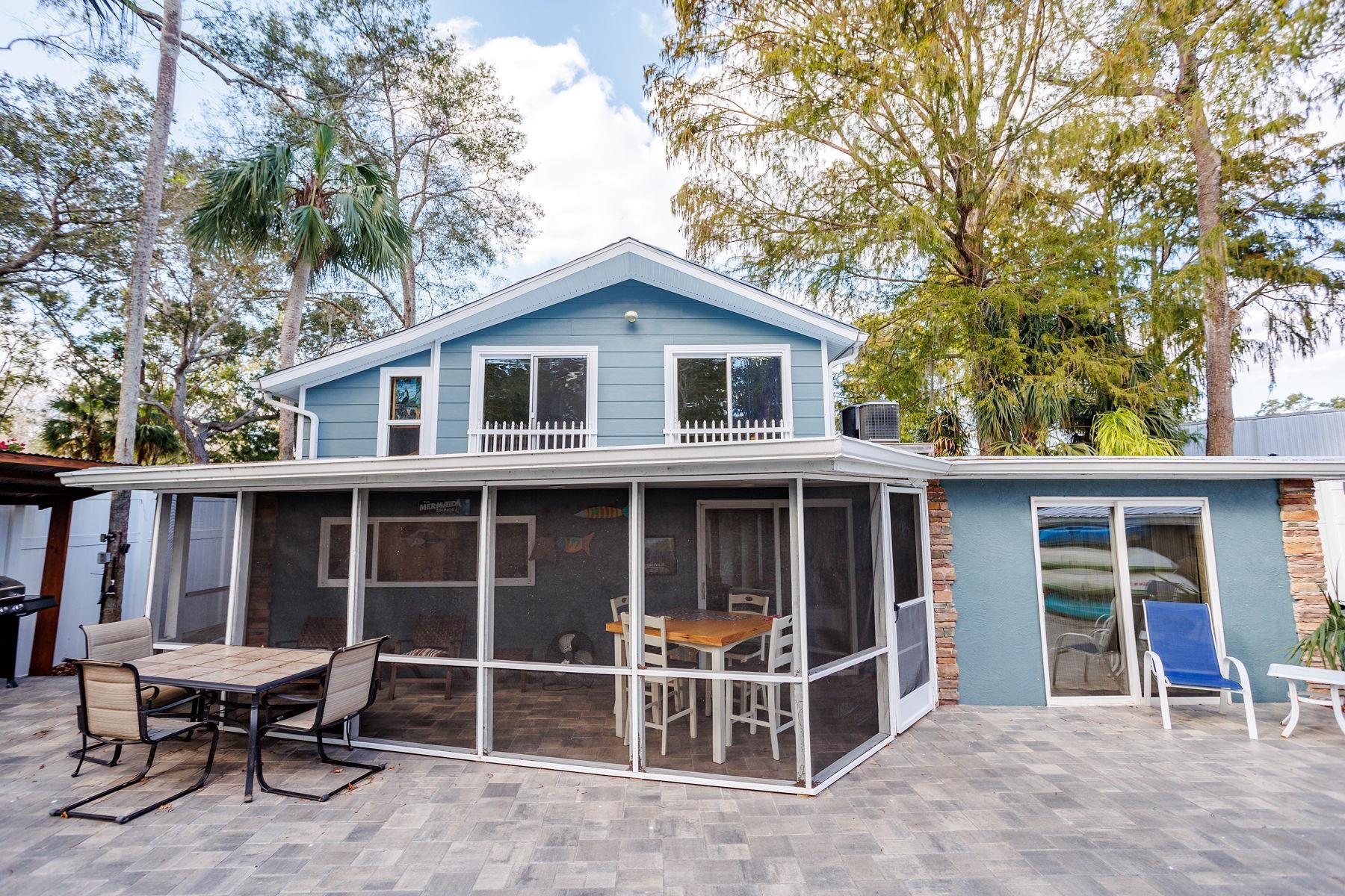 6194 Bear Trail Weeki Wachee, FL 34607 - Photo 38 of 68 a front view of a house with a yard and seating space