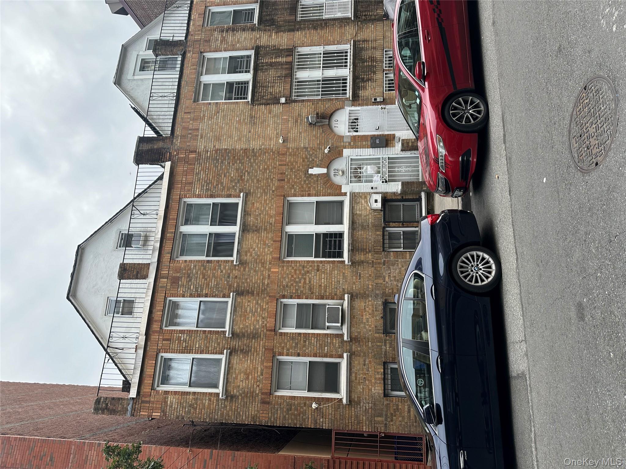 712 East 211th Street Bronx, NY 10467 - Photo 2 of 2 a car parked in front of a house