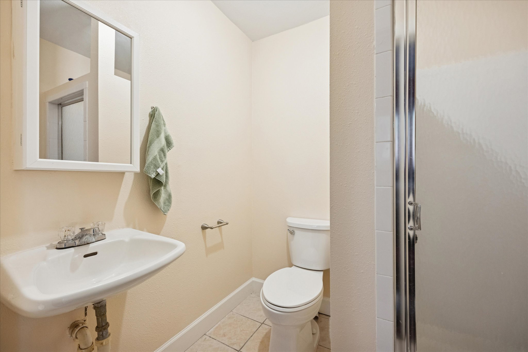 907 East 53rd Street Austin, TX 78751 - Photo 15 of 30 Bathroom with light tile patterned floors and a shower stall