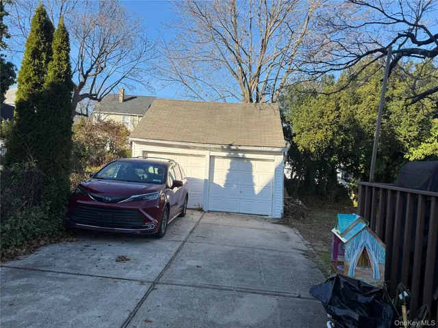 a view of backyard with barbeque grill and outdoor seating