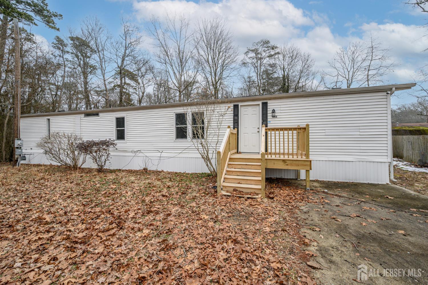 448 Evergreen Road Millville, NJ 08332 - Photo 1 of 29 a backyard of a house with table and chairs