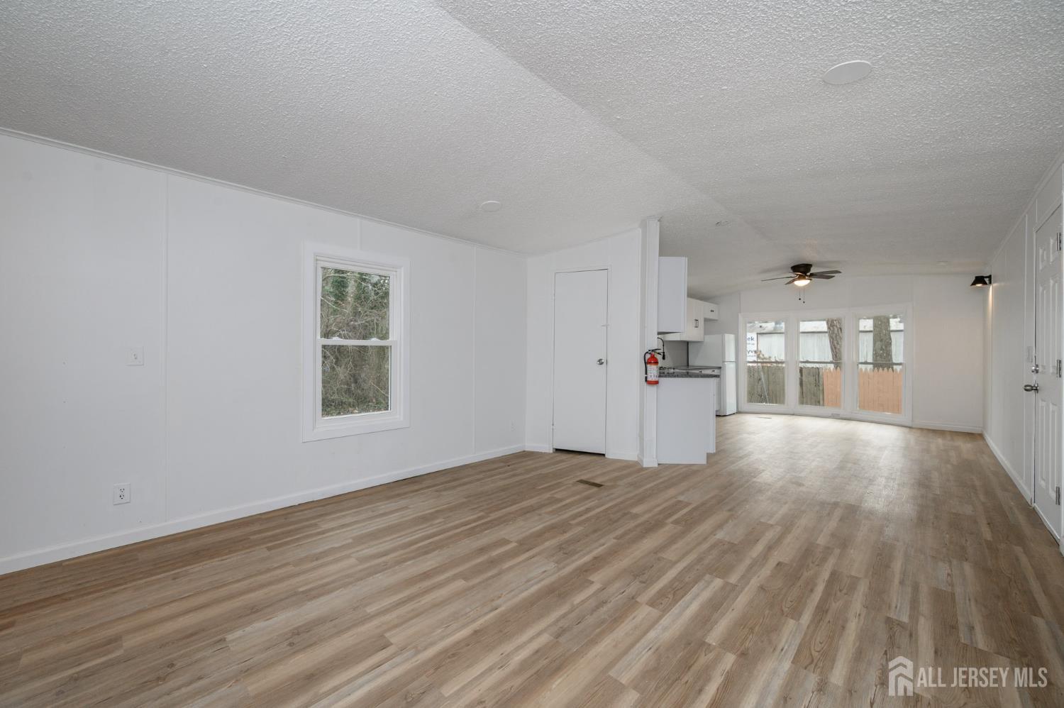 448 Evergreen Road Millville, NJ 08332 - Photo 11 of 29 a view of empty room with wooden floor and window