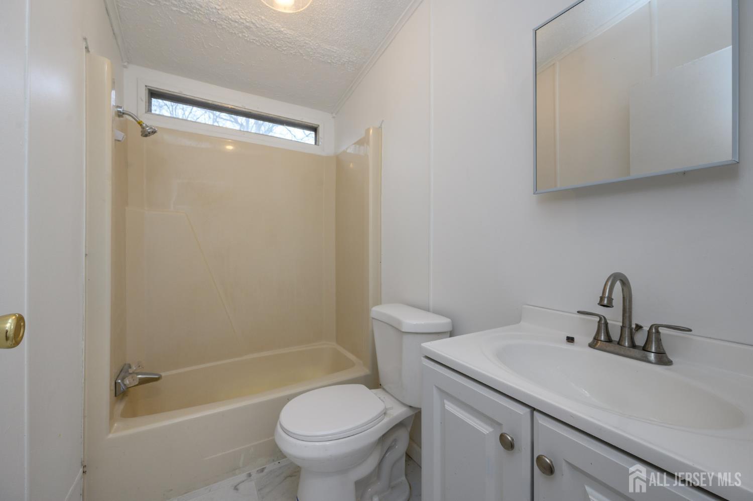 448 Evergreen Road Millville, NJ 08332 - Photo 12 of 29 a bathroom with a sink toilet and shower