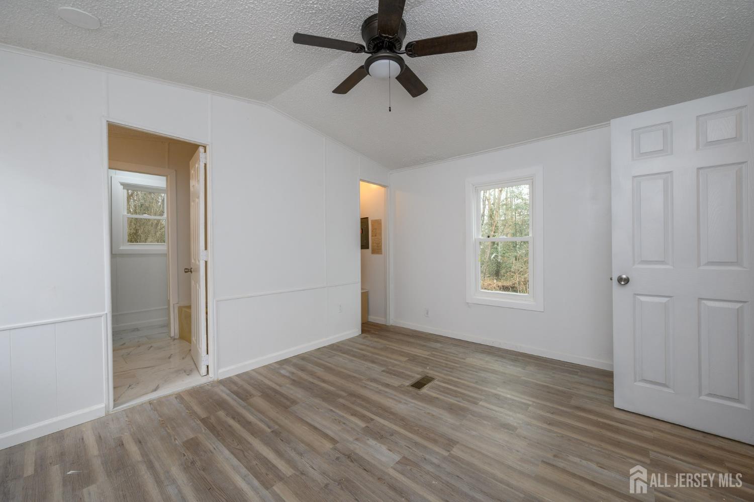 448 Evergreen Road Millville, NJ 08332 - Photo 16 of 29 wooden floor in an empty room with a window