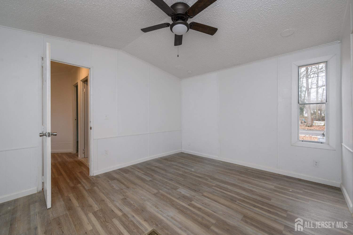 448 Evergreen Road Millville, NJ 08332 - Photo 17 of 29 wooden floor in an empty room with a window