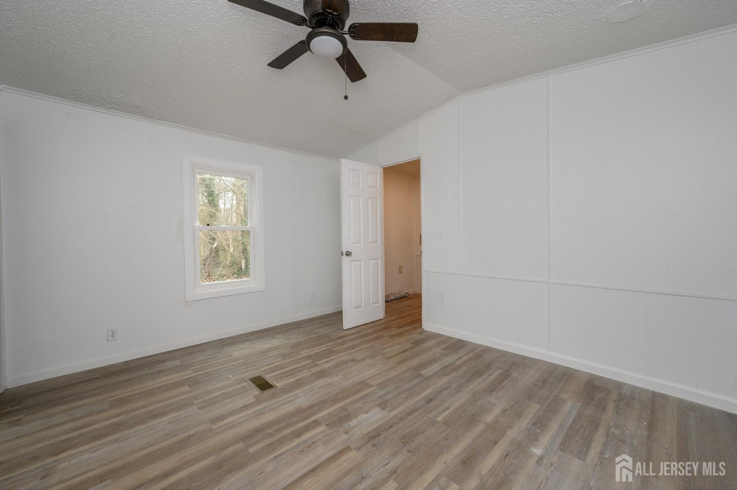 448 Evergreen Road Millville, NJ 08332 - Photo 18 of 29 wooden floor in an empty room with a window