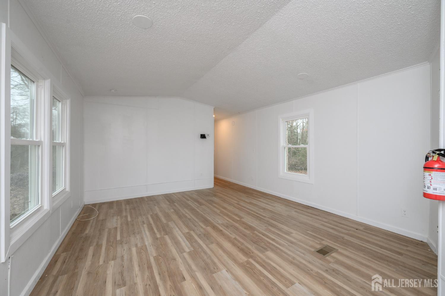 448 Evergreen Road Millville, NJ 08332 - Photo 8 of 29 wooden floor in an empty room with a window