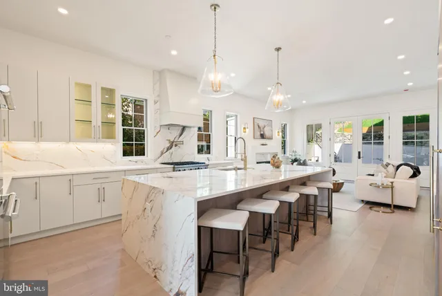 a kitchen with counter space dining table and chairs