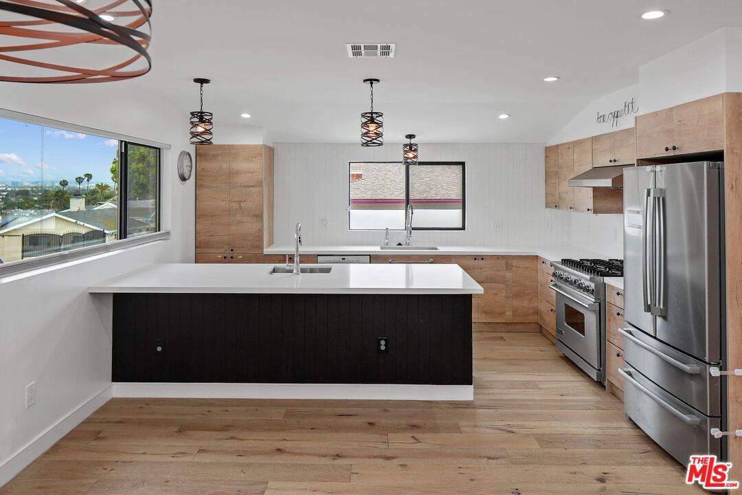 5922 Wrightcrest Drive Culver City, CA 90232 - Photo 5 of 25 a kitchen with a refrigerator and a sink