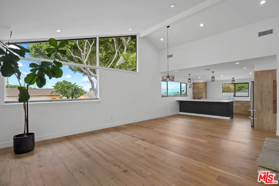 5922 Wrightcrest Drive Culver City, CA 90232 - Photo 8 of 25 a view of a kitchen with wooden floor and a window