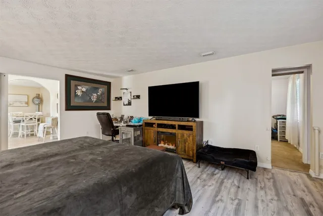 a living room with a bed furniture and a window