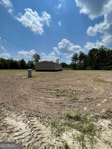 a view of a lake with a big yard