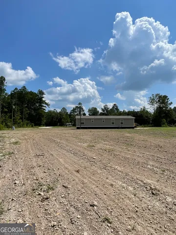 a view of lake with green space