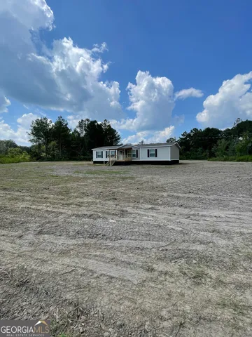 a view of a lake with a big yard
