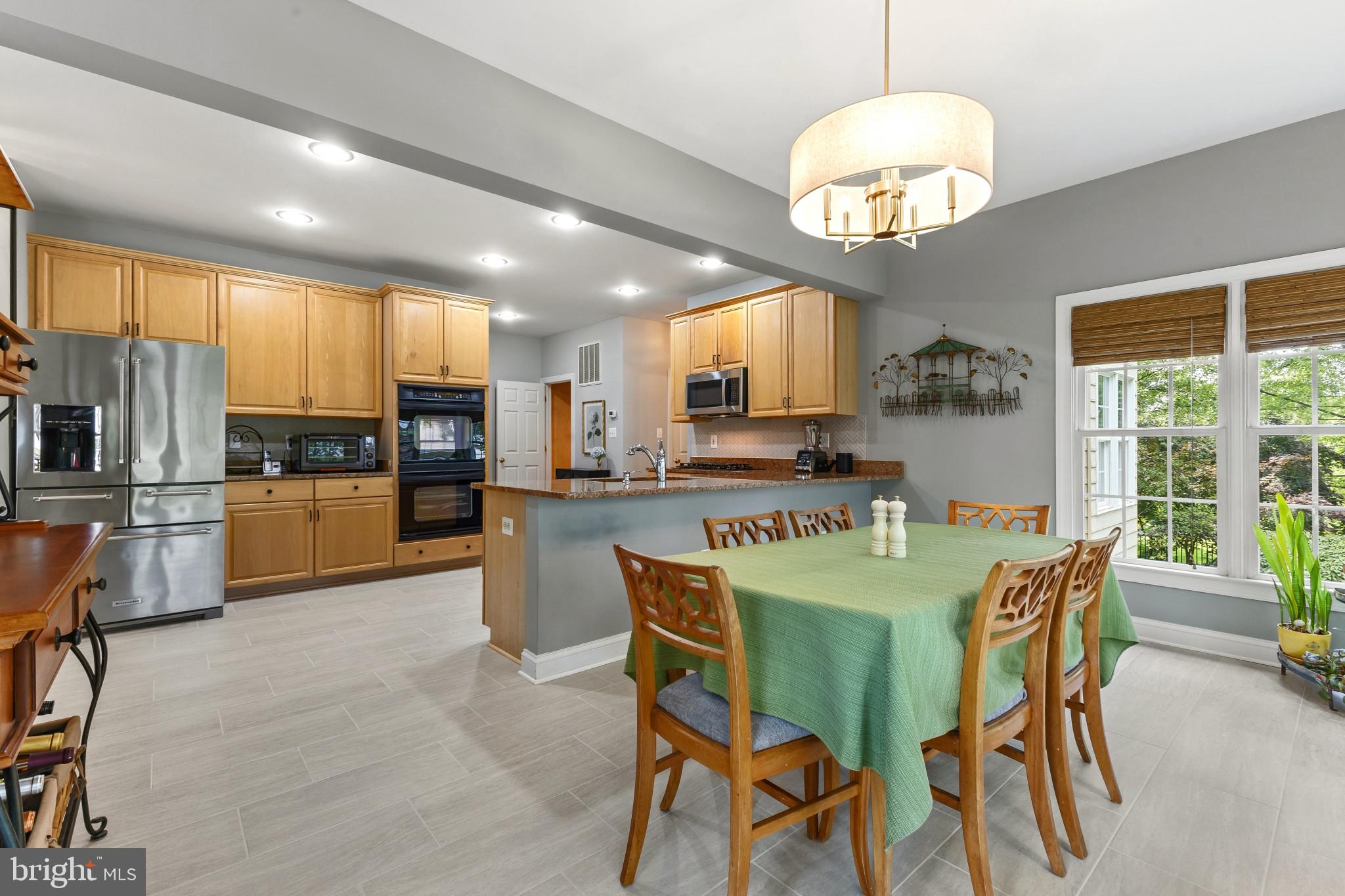 15006 Ransom Oaks Court Gainesville, VA 20155 - Photo 13 of 57 Modern kitchen with inviting dining area.