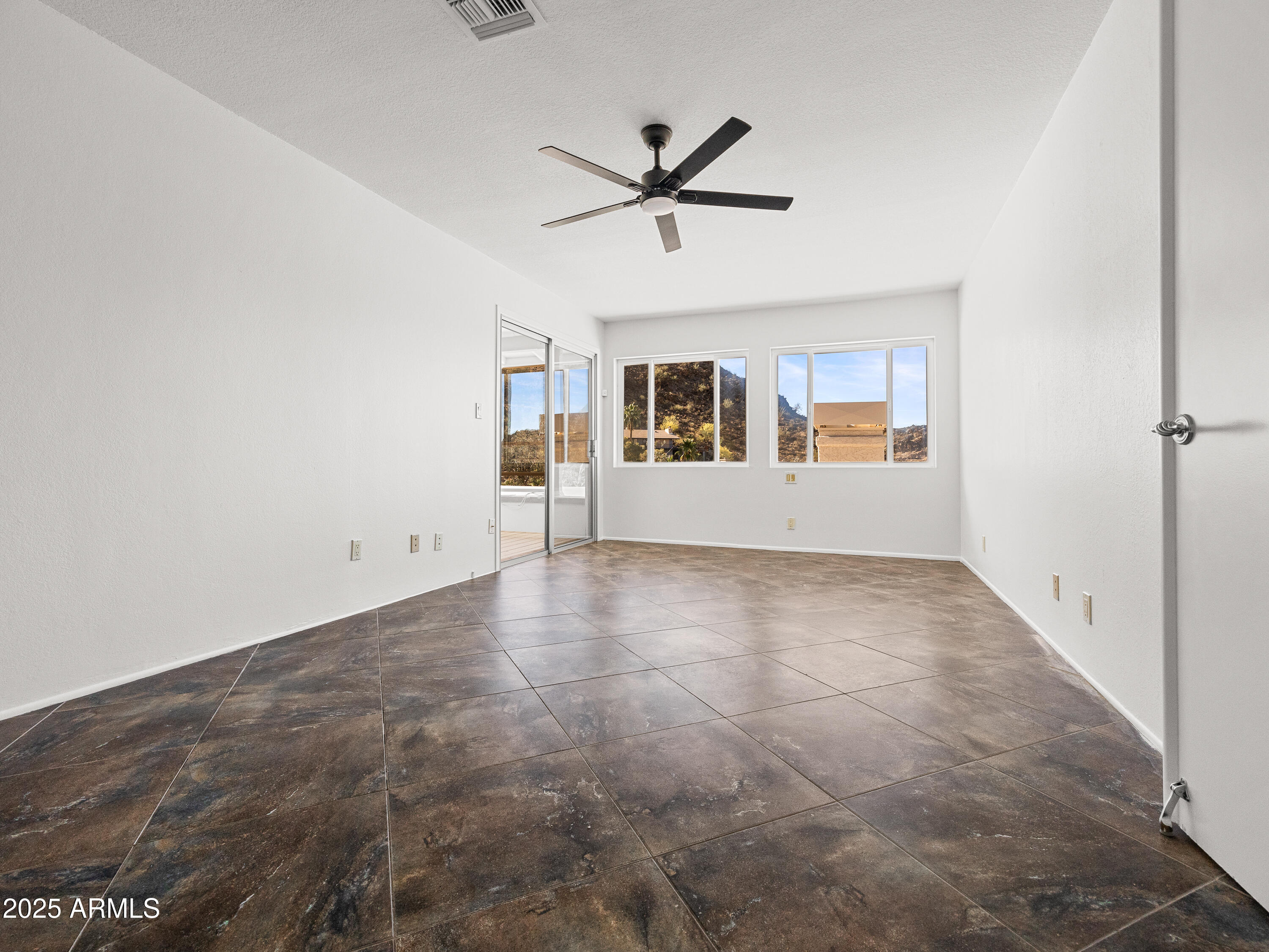 1836 East Turquoise Avenue Phoenix, AZ 85020 - Photo 45 of 63 a view of a livingroom with a ceiling fan and window