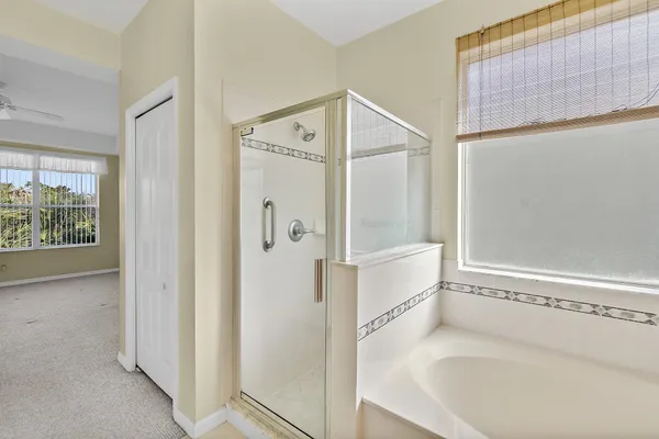 a bathroom with a bathtub and a shower